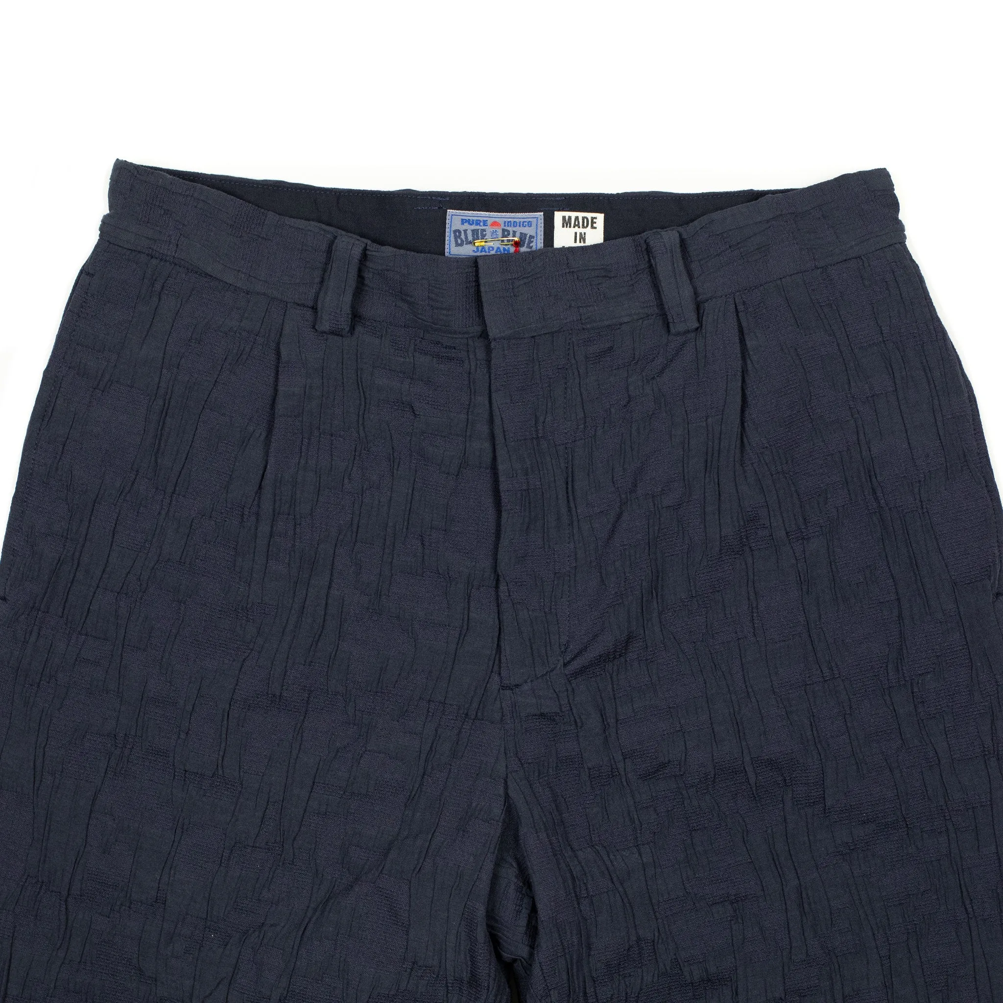 Single-pleat floating jacquard indigo cotton pants