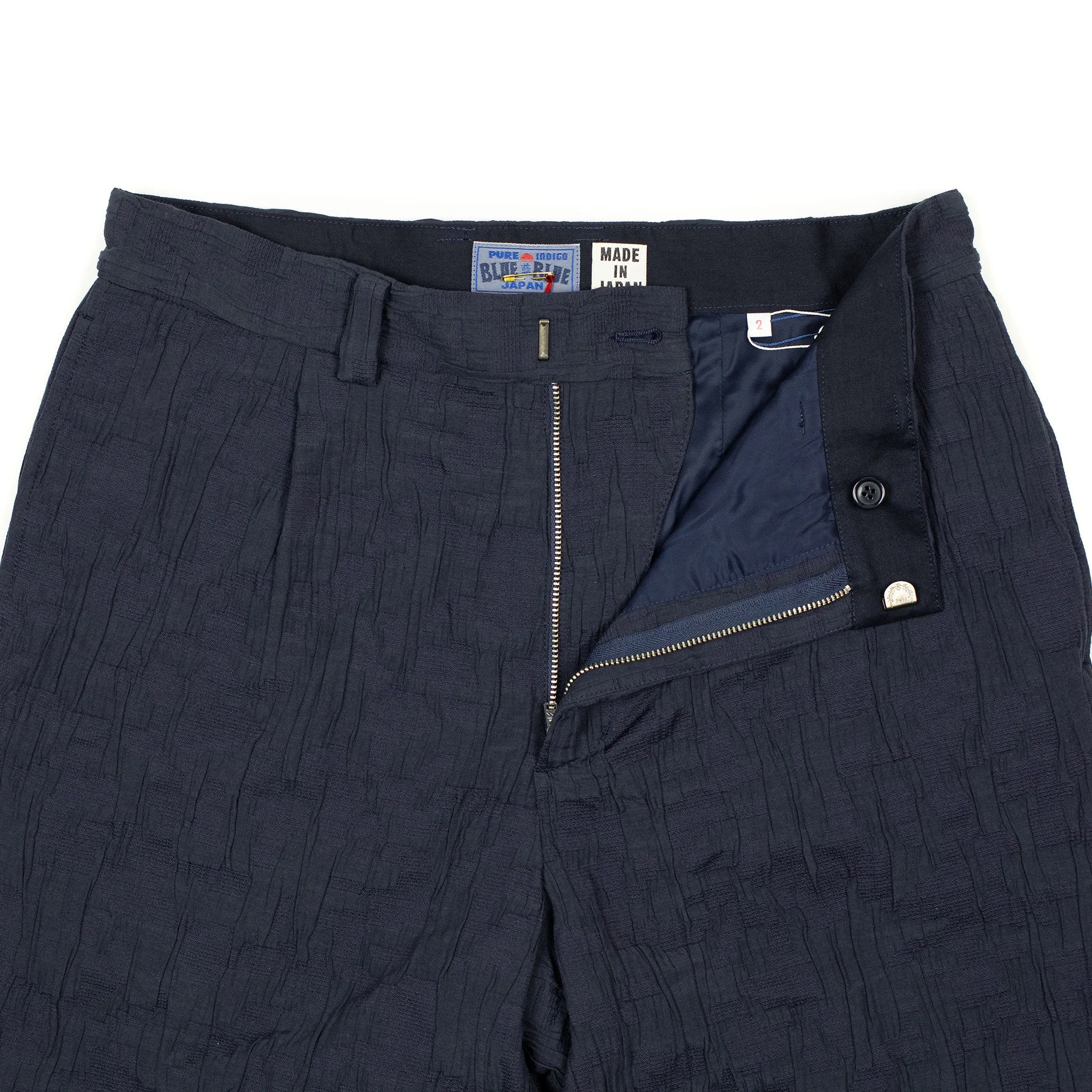 Single-pleat floating jacquard indigo cotton pants